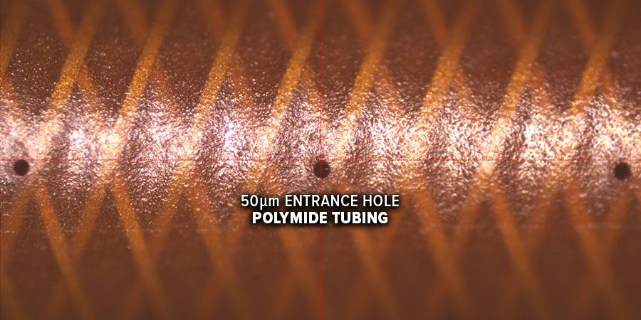 laser drilled 50um exit hole in reinforced polyimide medical tubing