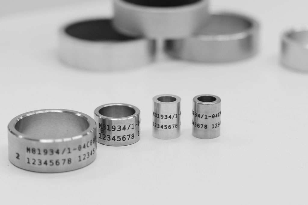 Laser engraved metal rings with text and numbers