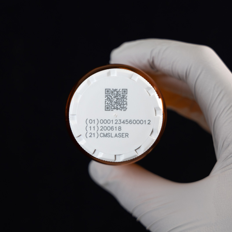 Laser marked UDI information on medical plastic lid