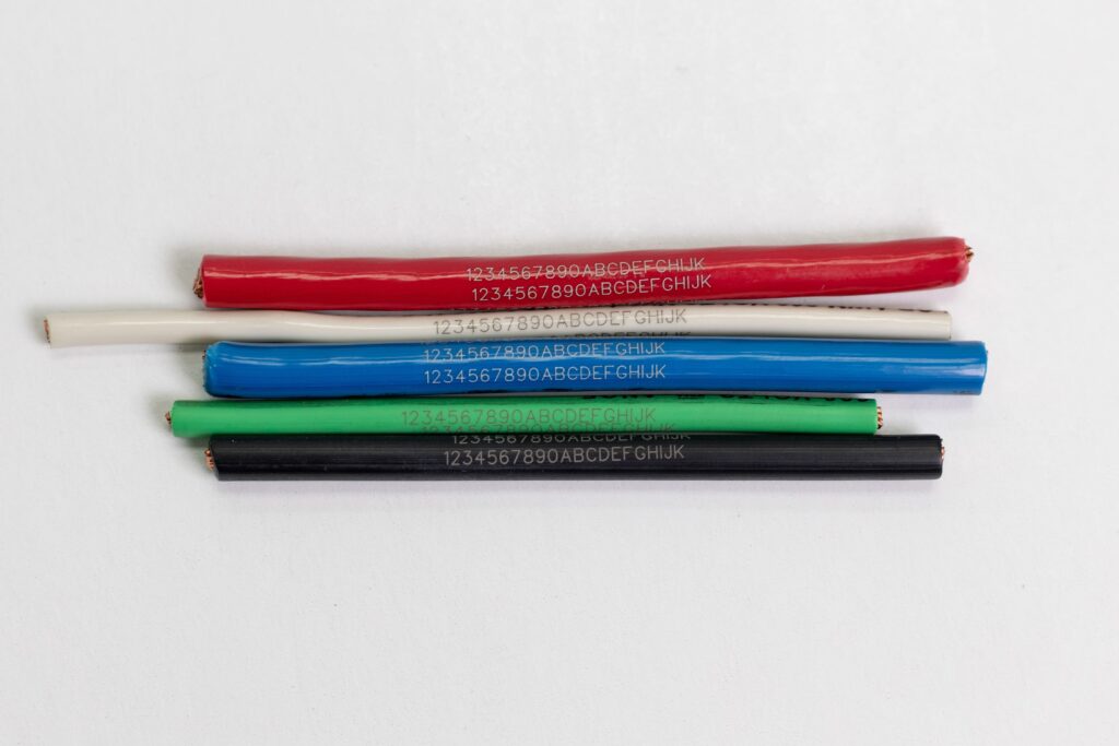 Laser marked various colored wires with text