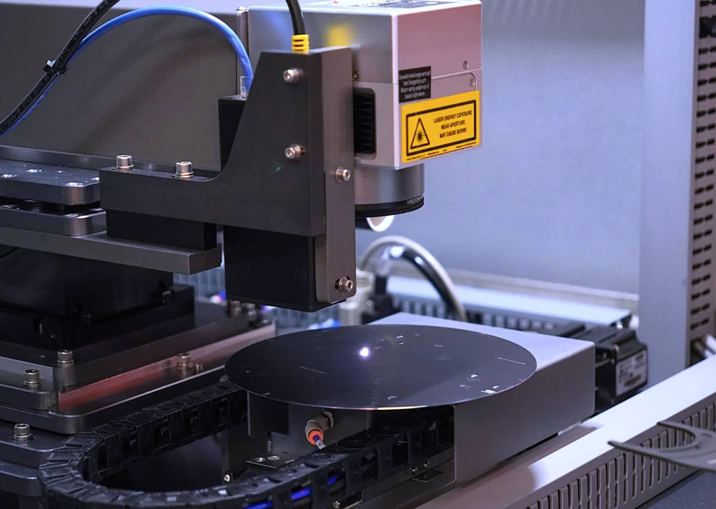CMS Laser semiconductor laser machine in action, precisely processing a wafer with advanced technology.