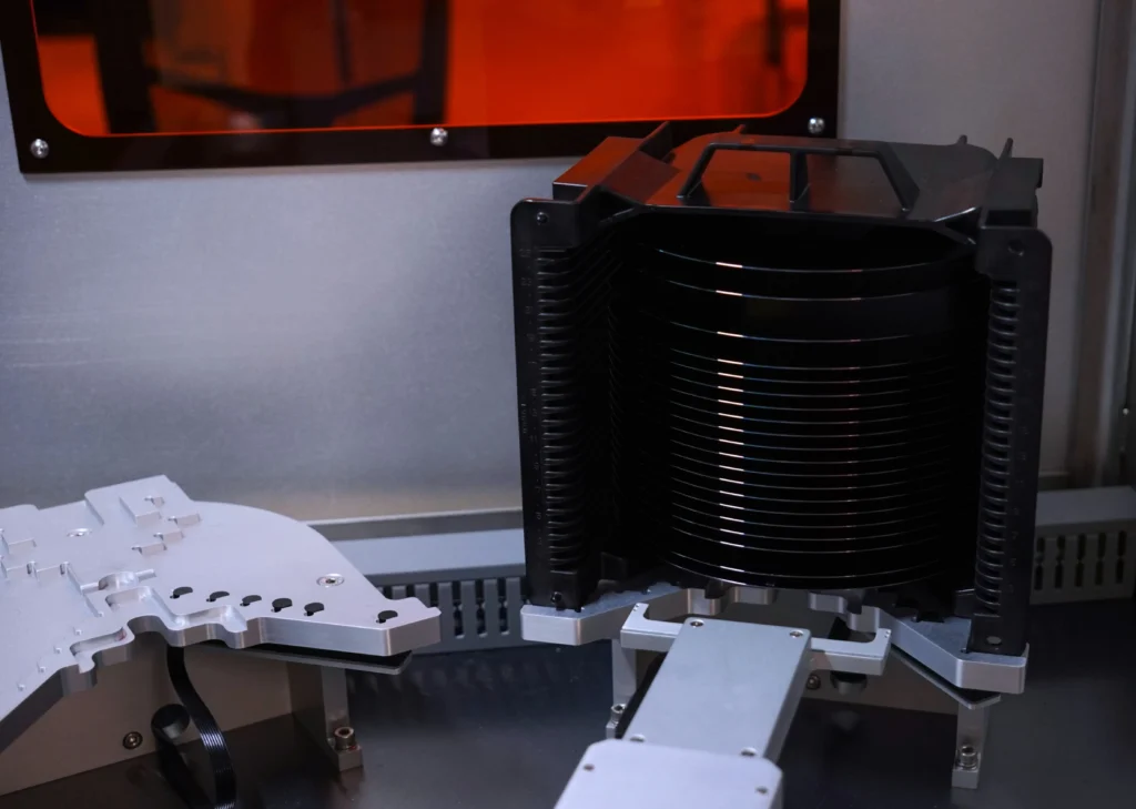 CMS Laser wafer handling system with a stack of semiconductor wafers in a precision manufacturing environment.